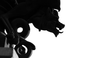 Black and wite silhouette of gargoyle isolated on a wite background.