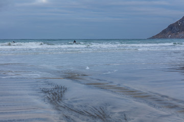 beautiful sunset under blue hour over fjord in polar night on Lofoten islands, Norway.