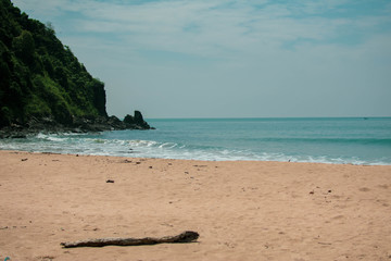 Beautiful clear beach without people and a bright aqua sea in Thailand