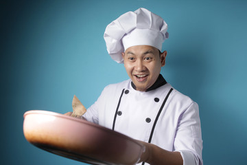 Asian Malen Chef Ready to Cook, Chef Holding Kitchen Tools Spatula and Pan