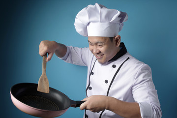 Asian Malen Chef Ready to Cook, Chef Holding Kitchen Tools Spatula and Pan