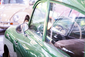control wheel inside green classic car
