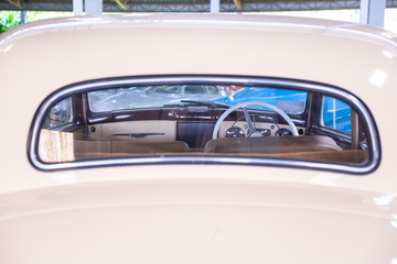 frame of control wheel inside a vintage car .