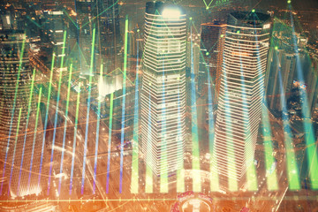 Financial chart on city scape with tall buildings background multi exposure. Analysis concept.
