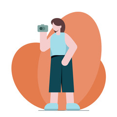 portrait of beautiful young photographer woman taking photos using her digital camera