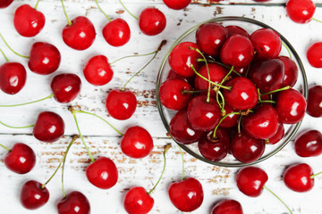 Fototapeta na wymiar A small glass bowl with ripe fresh cherry 
