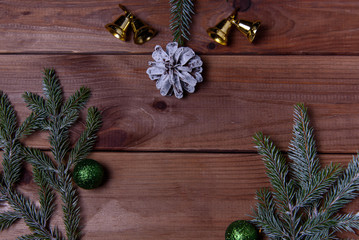 Christmas, decorations on a wooden table. New Year's pine cones and New Year's balls. Place for text