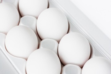 Fresh white chicken eggs in a package