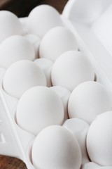 Fresh white chicken eggs in a package