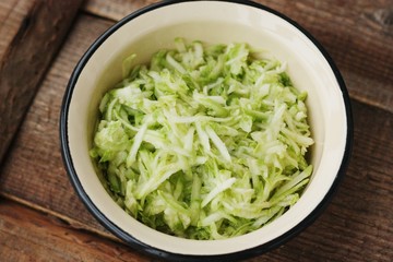Fresh zucchini grated on a grater macro