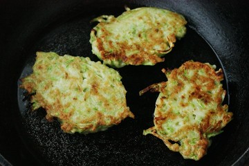 Delicious zucchini cutlets in a frying pan