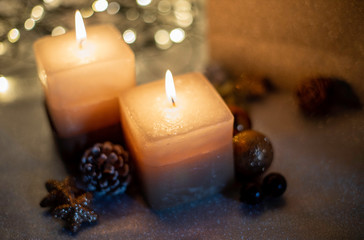 two candles and chrismas ornaments