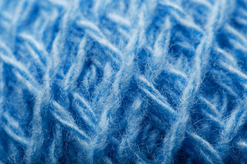 Obraz premium Wool yarn close-up colorful blue threads for needlework in macro.