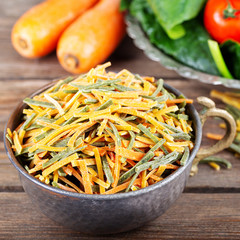 uncooked vegetable noodles with fresh vegetables