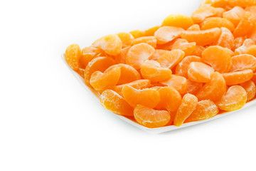 Juicy orange slices of MANDARIN in a rectangular white plate on a white background. Isolate.
