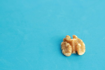 Peeled walnuts in colorful background