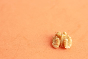 Peeled walnuts in colorful background