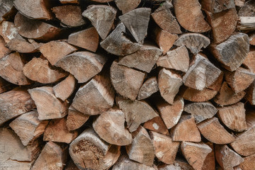 Stacked chopped logs. Firewood texture. Close-up