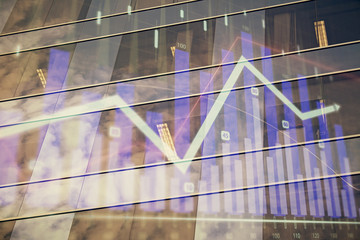 Forex chart on cityscape with tall buildings background multi exposure. Financial research concept.