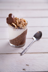 Delicious breakfast, cocoa chia pudding with yogurt and cereals