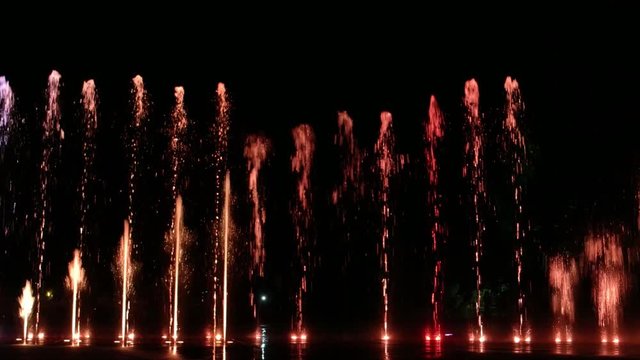 Colorful water fountain dance show with laser light