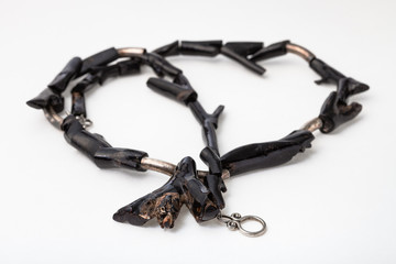 coiled necklace from polished black coral twigs