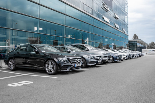 Mercedes Benz cars parked in row
