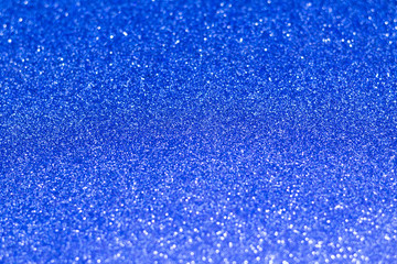 Classic blue abstract background. Glitter bokeh on trendy blue background. 