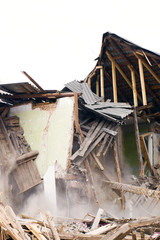 Destroyed old wooden house. Demolition of the house.