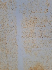  close-up of a decorative wall, with bokeh effect and characteristic rough porous texture, abstract dark and light stains