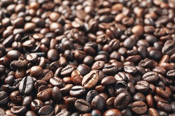 Textured background of coffee beans, close up