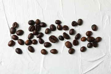 Coffee beans on white background, top view and space for text