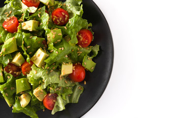 Salad with avocado, lettuce, tomato, flax seeds isolated on white background top view copy space	