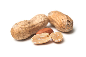 closeup of organic peanuts on white background