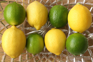 Alternating Lemons and Limes in a glass bowl