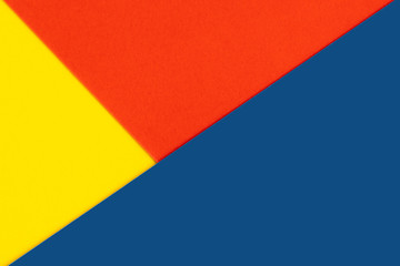 Yelllow blue red color paper background. Geometric figures, shapes. Abstract geometric flat composition. Empty space on monochrome cardboard.