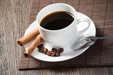 Cup of espresso coffee on wooden table
