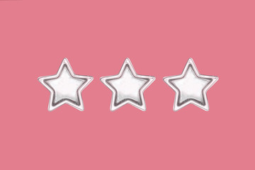Obraz premium Christmas three five pointed golden stars on pink background. Christmas decoration.