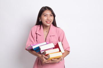 Naklejka premium Young Asian woman studying with may books.