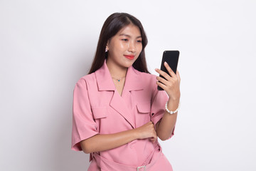 Young Asian woman with mobile phone.