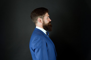 Obraz premium Well groomed man beard in suit. Male fashion and aesthetic. Businessman formal outfit. Classic style aesthetic. Masculine aesthetic. Few grooming life hacks help achieve great look, whatever occasion