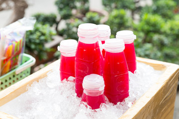 Cold pomegranate bottles for sale in the street market