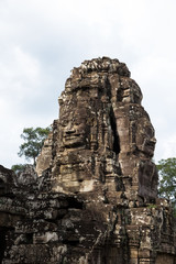 Carved stone faces in Bayon temple in Angkor Thom, Siem Reap province, Cambodia