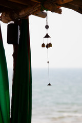 Wind chimes on the sea background. The view from the cafe. India. GOA