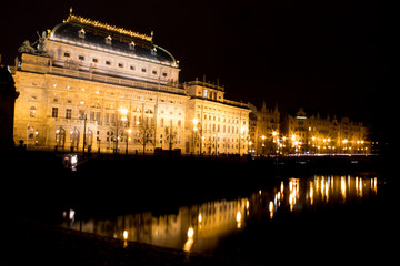  Night city landscape and panorama in the bright evening lights of the Czech capital Prague overlooking the Vltava River.