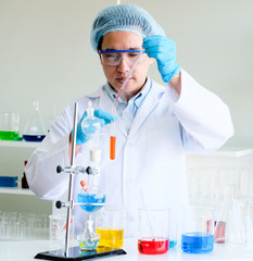 Male scientist and laboratory experiment