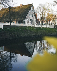 Old house reflection in a river in Germany