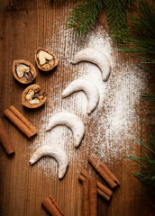 sweet christmas cookies Vanillekipferl on old wooden table
