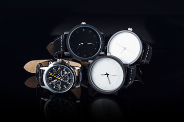 Wrist watch on black background with reflection