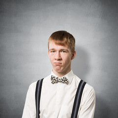 Unhappy young man looking at camera